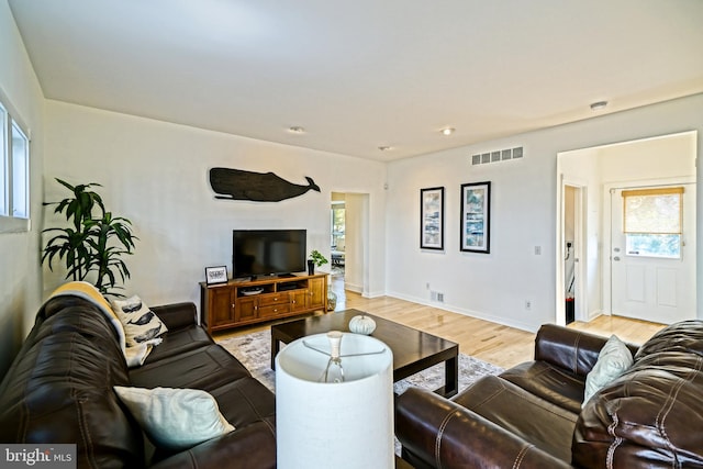 living room featuring light hardwood / wood-style flooring and plenty of natural light