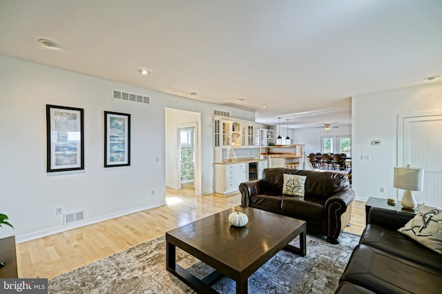 living room with light hardwood / wood-style floors