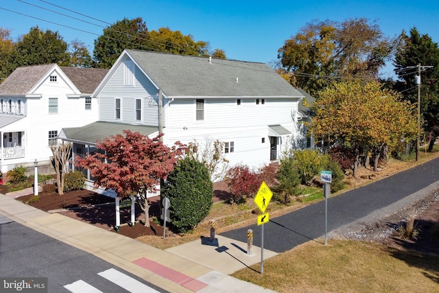 view of side of property with a yard