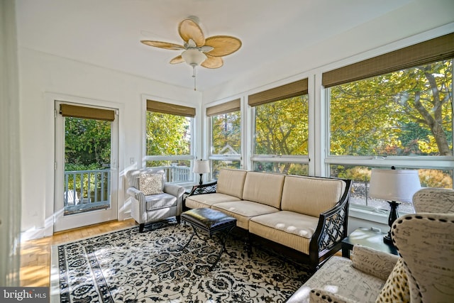 sunroom / solarium featuring ceiling fan