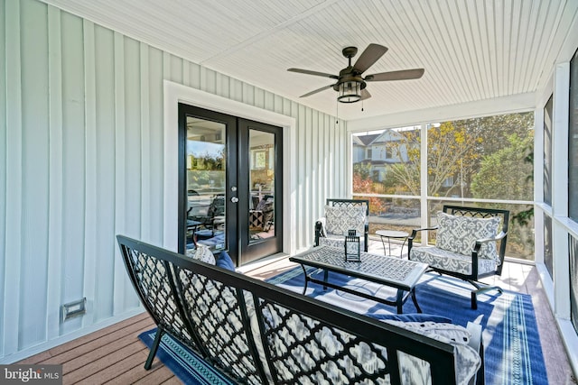 sunroom featuring french doors and ceiling fan