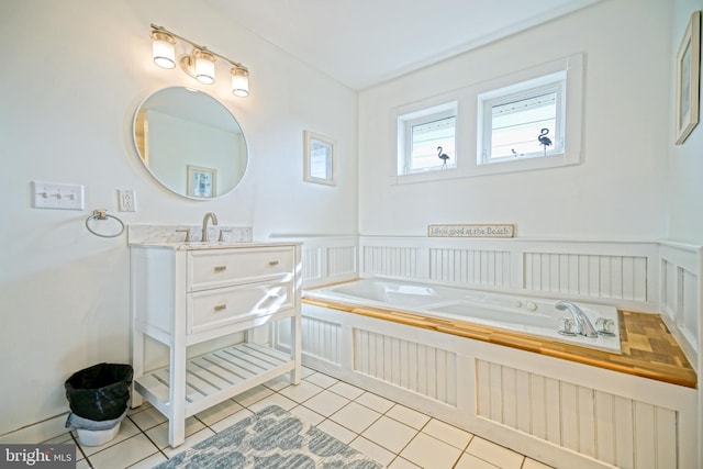 bathroom featuring vanity, tile patterned floors, and a washtub