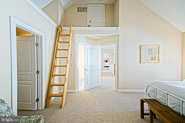 bedroom featuring lofted ceiling and carpet floors