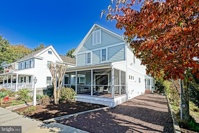 view of property featuring a sunroom