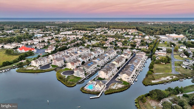 aerial view at dusk with a water view