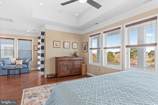 bedroom featuring ornamental molding, dark wood-type flooring, multiple windows, and ceiling fan