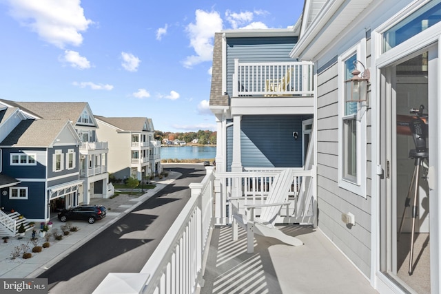 balcony featuring a water view