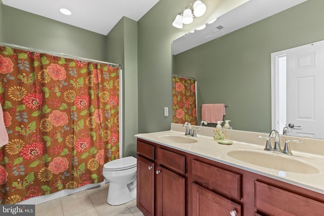 bathroom featuring vanity, toilet, tile patterned floors, and curtained shower