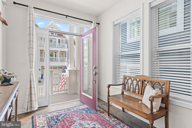 entryway with tile patterned floors and a healthy amount of sunlight