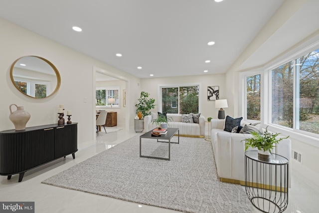 living area with visible vents and recessed lighting