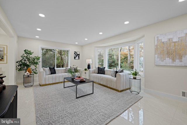 living area featuring recessed lighting, visible vents, baseboards, and tile patterned floors