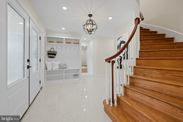 mudroom with light tile patterned floors, a chandelier, and recessed lighting