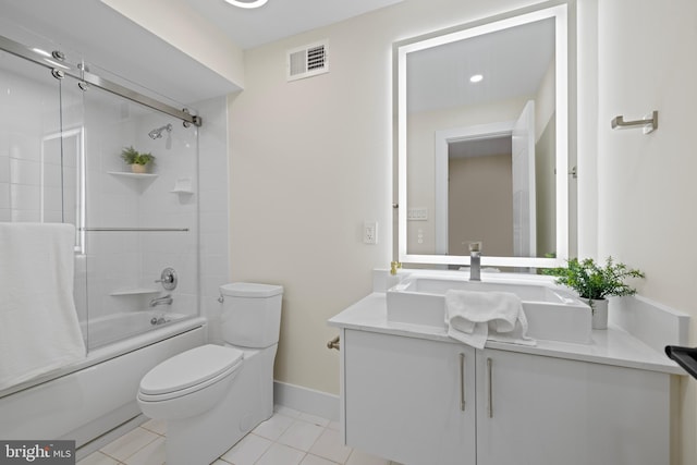 full bathroom with visible vents, toilet, enclosed tub / shower combo, vanity, and tile patterned flooring