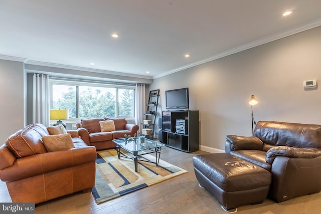 living room with light wood-type flooring and ornamental molding