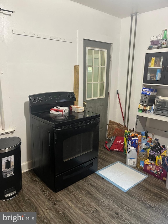 room details featuring hardwood / wood-style flooring and black electric range