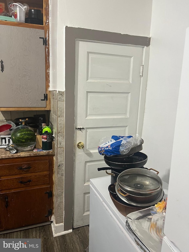 laundry room featuring dark hardwood / wood-style flooring