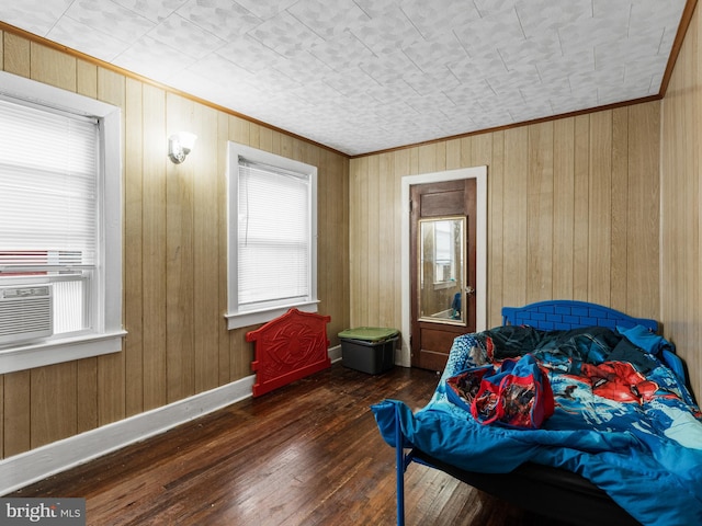 bedroom with wooden walls, cooling unit, and dark wood-type flooring