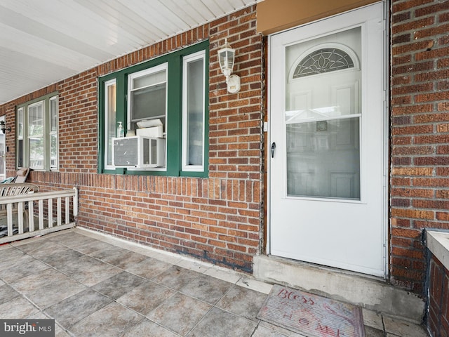 doorway to property featuring a porch