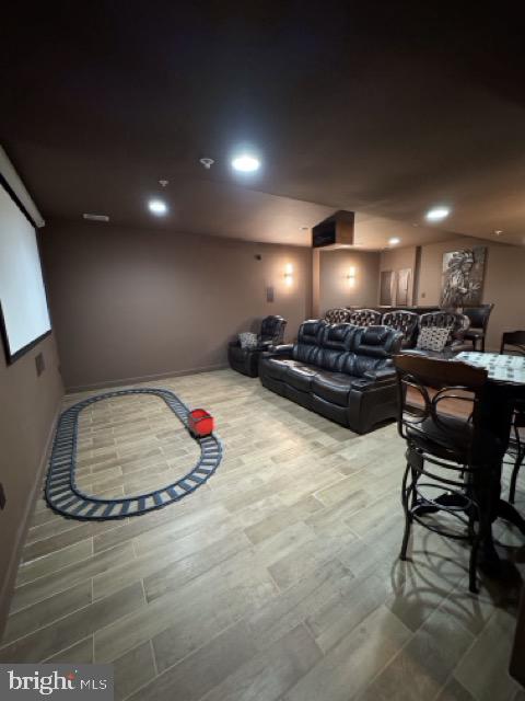 home theater featuring hardwood / wood-style floors