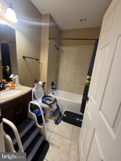 bathroom with vanity, tile patterned flooring, and shower / tub combo with curtain