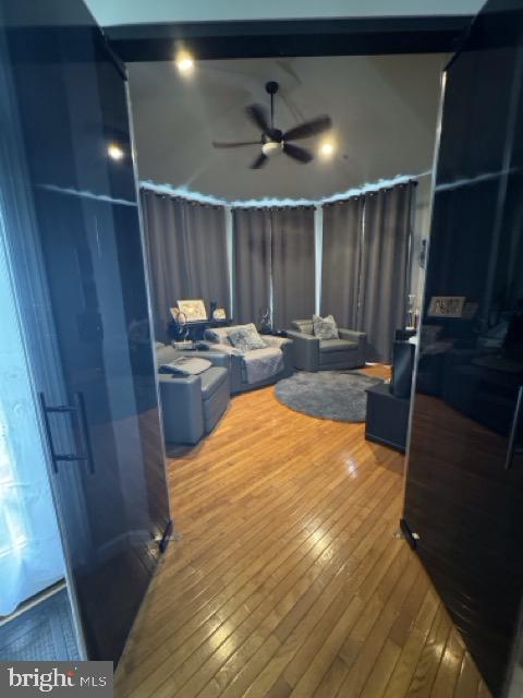 bedroom with hardwood / wood-style floors and ceiling fan