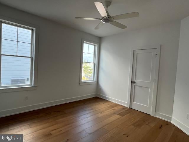 unfurnished room featuring ceiling fan and wood-type flooring