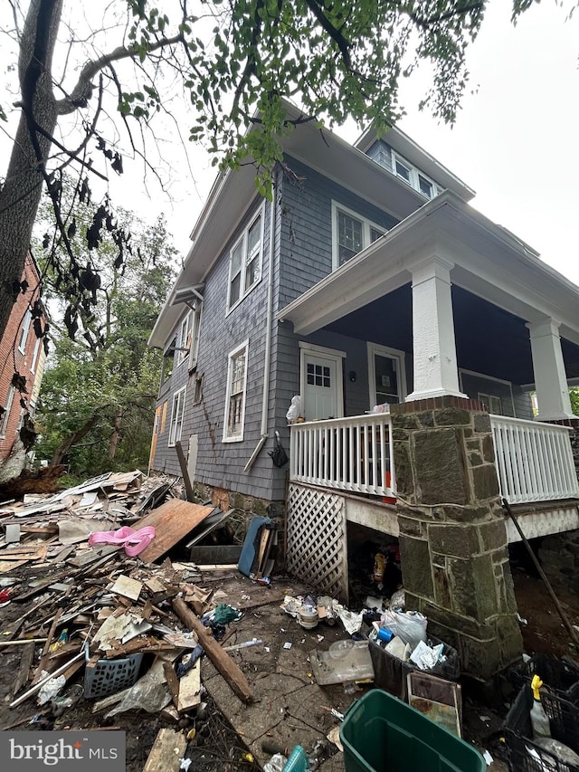 view of side of home featuring a porch