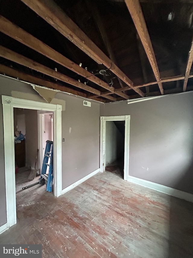 unfurnished room featuring visible vents and baseboards