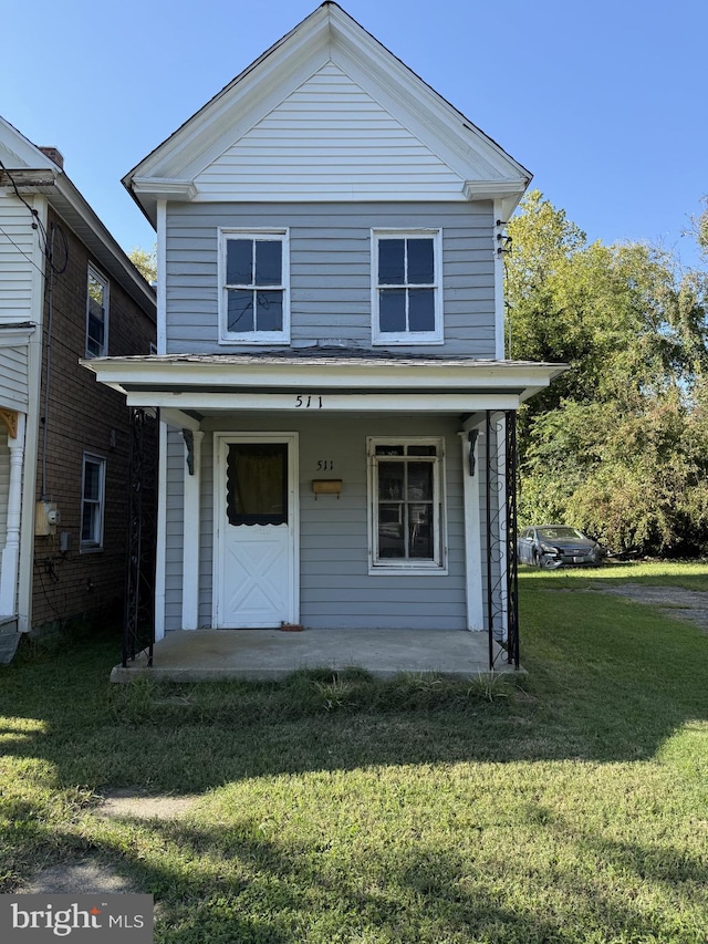 view of front property with a front lawn and covered porch