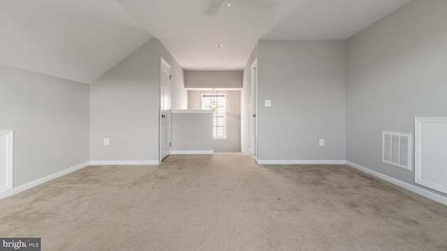 interior space with light carpet and ceiling fan