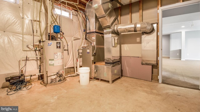 utility room with heating unit and gas water heater