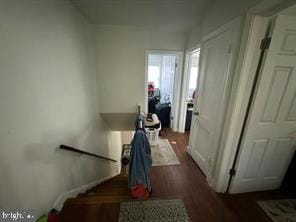 hallway featuring dark hardwood / wood-style floors