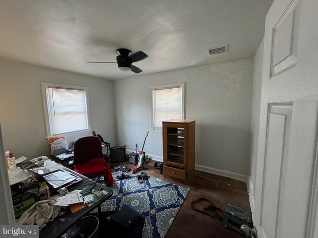 office featuring ceiling fan, plenty of natural light, and hardwood / wood-style floors