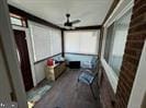 sunroom / solarium with ceiling fan