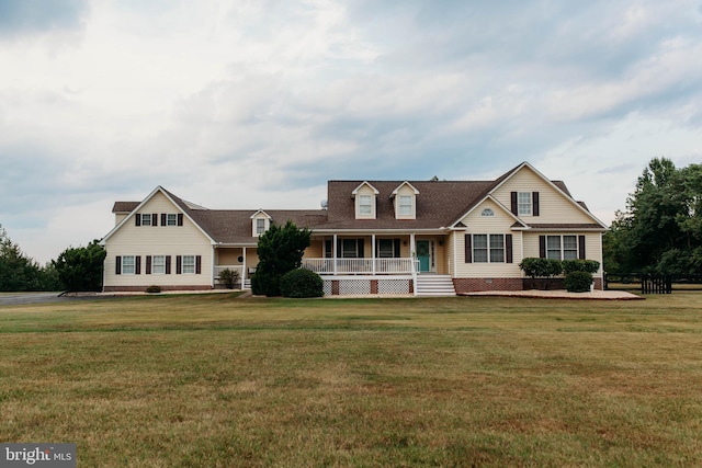 cape cod home with covered porch and a front yard