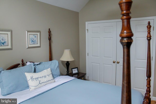 bedroom featuring lofted ceiling