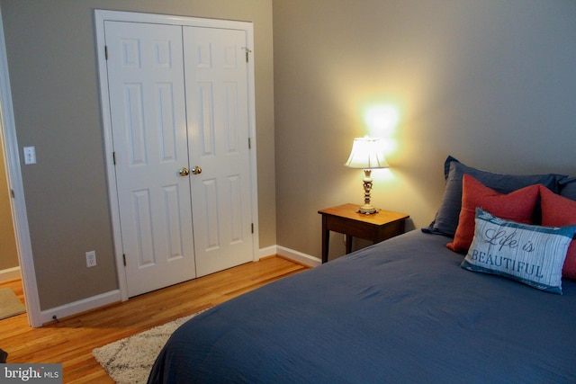 bedroom featuring hardwood / wood-style flooring and a closet