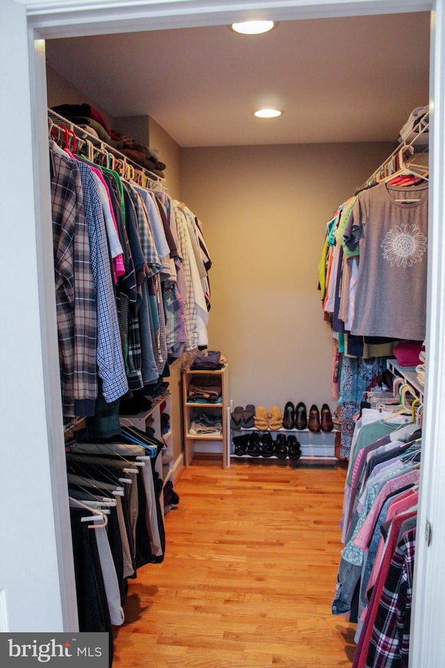 spacious closet featuring hardwood / wood-style flooring