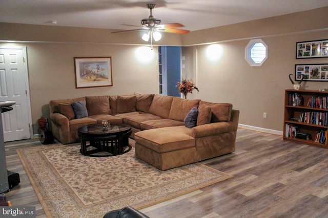 living room with ceiling fan and hardwood / wood-style floors