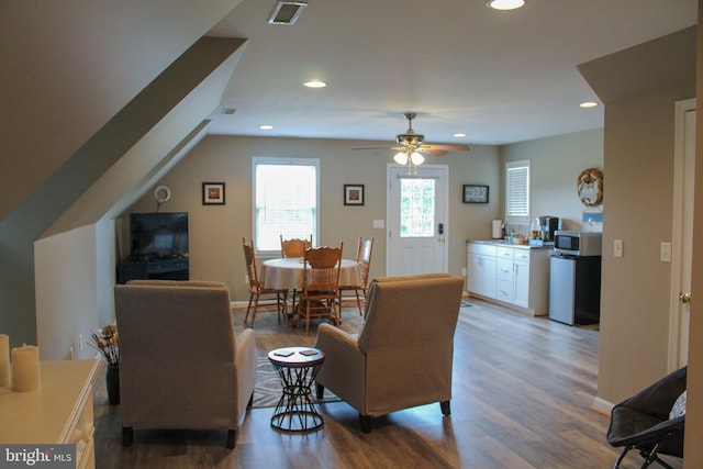 living room with ceiling fan and hardwood / wood-style floors