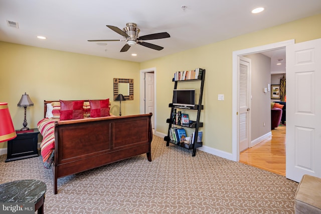 bedroom with hardwood / wood-style floors and ceiling fan