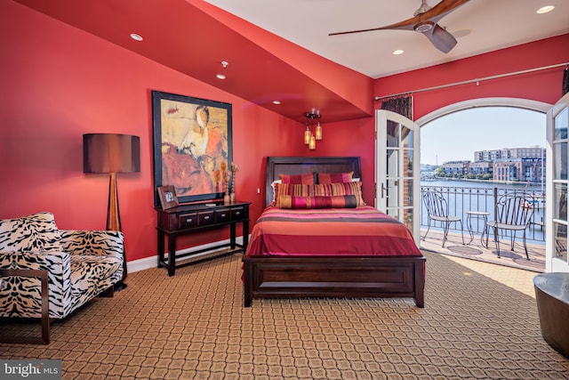 bedroom featuring access to outside, vaulted ceiling, carpet, and ceiling fan