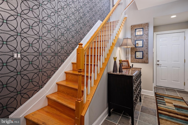 stairs featuring tile patterned floors