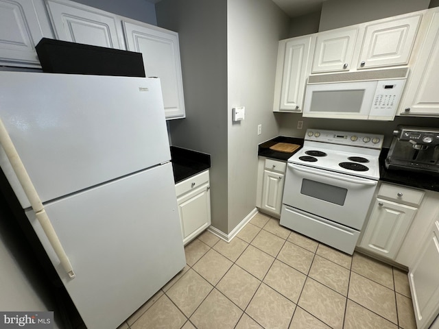 kitchen featuring white cabinets, light tile patterned floors, and white appliances