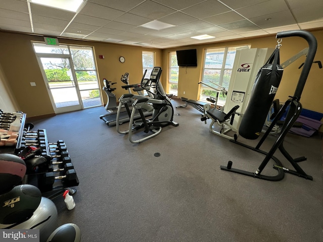 exercise room featuring a paneled ceiling