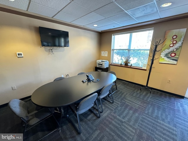 carpeted office featuring a drop ceiling