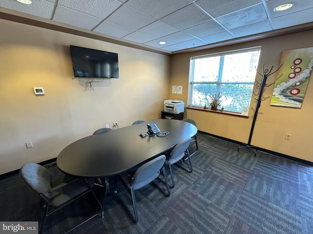 carpeted office featuring a drop ceiling