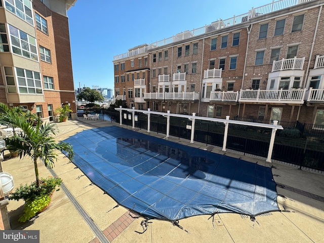 view of swimming pool with a patio area