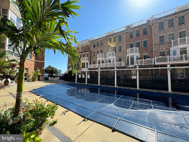 view of swimming pool with a patio