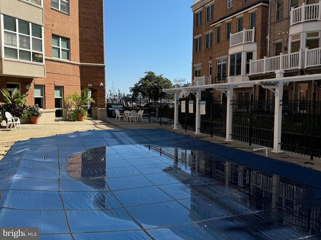 view of swimming pool with a patio area